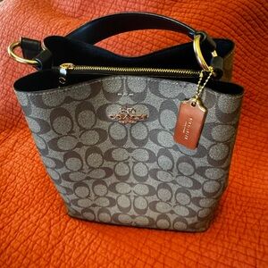 Coach Brown and Tan Signature Bucket Bag with Gold Accents.